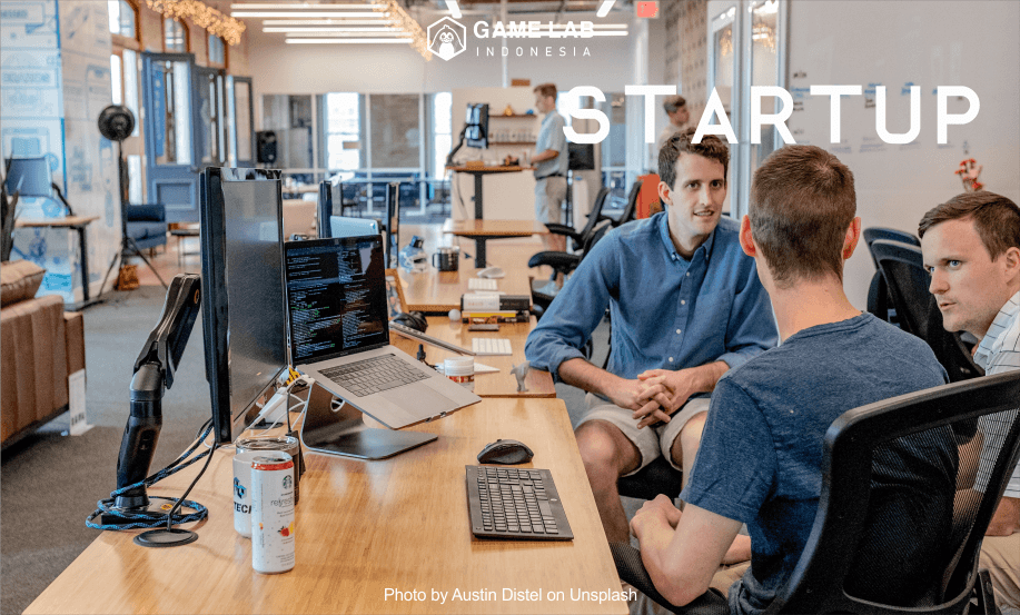 "three men sitting on chair beside tables" Photo by Austin Distel on Unsplash 