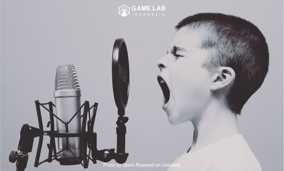 "boy singing on microphone with pop filter" Photo by Jason Rosewell on Unsplash 